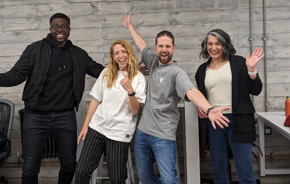 4 team members smiling